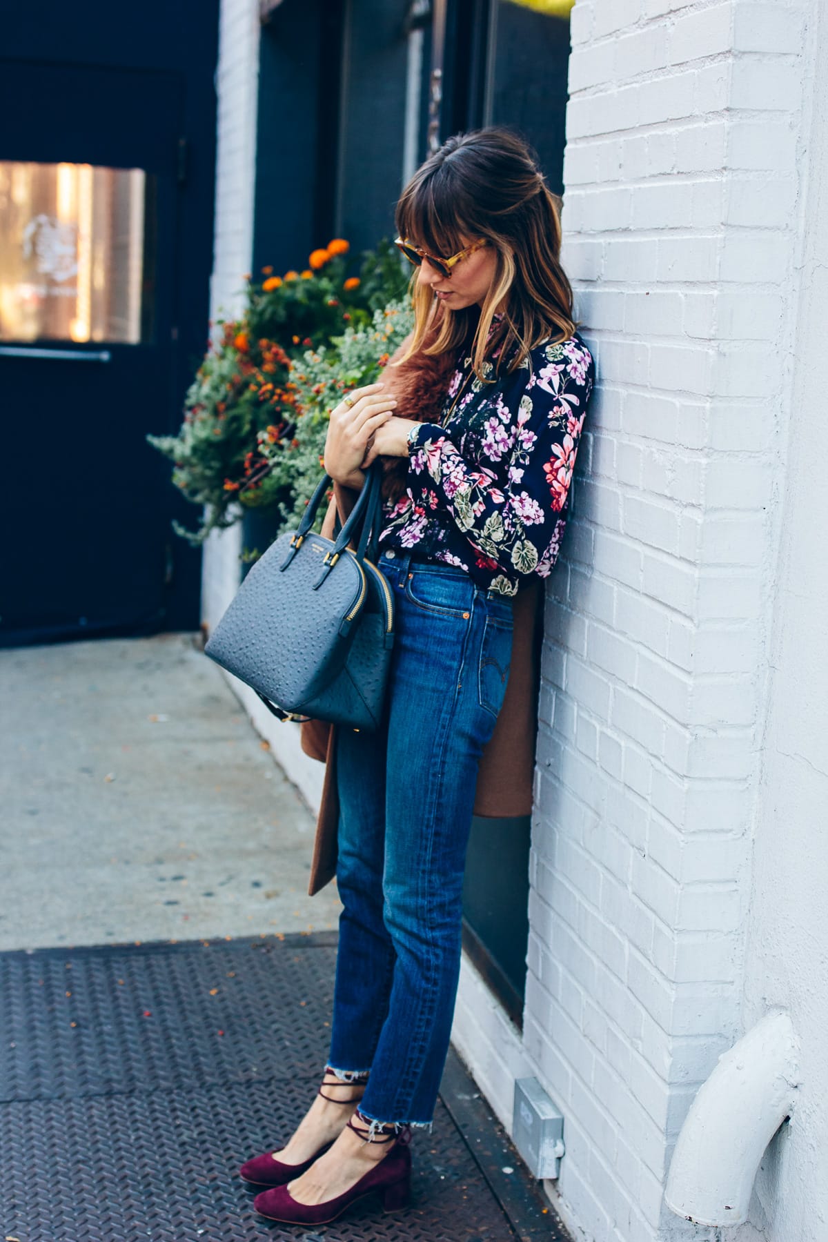 high rise mom jeans with a floral blouse