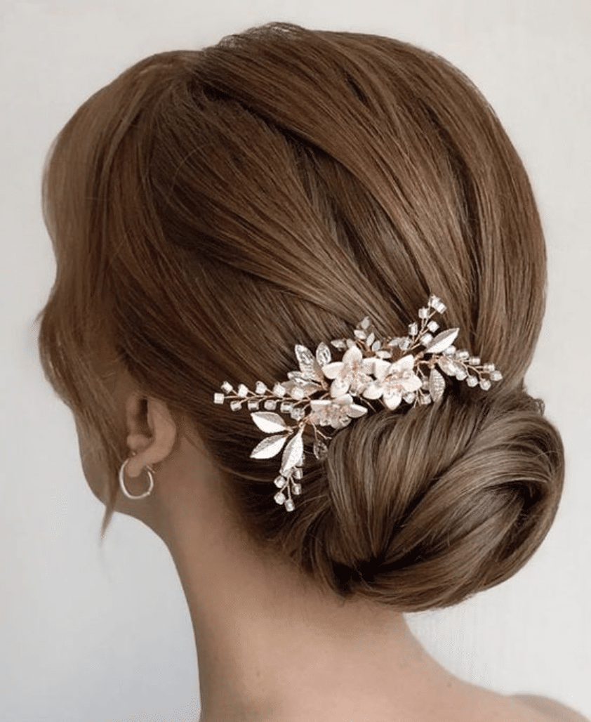 Low bun with flower accessories hairstyle