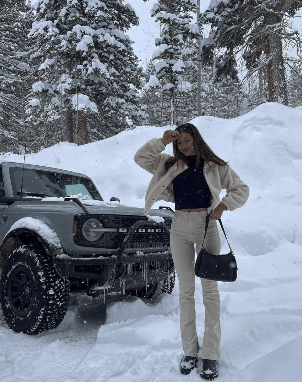 beige and black ski trip outfit