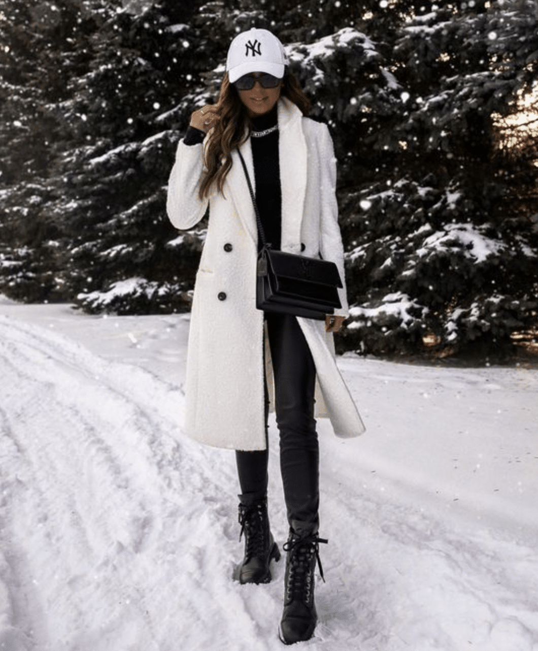 white coat and cap ski trip outfit
