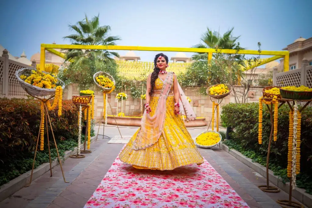 yellow lehenga with floral jewelry 